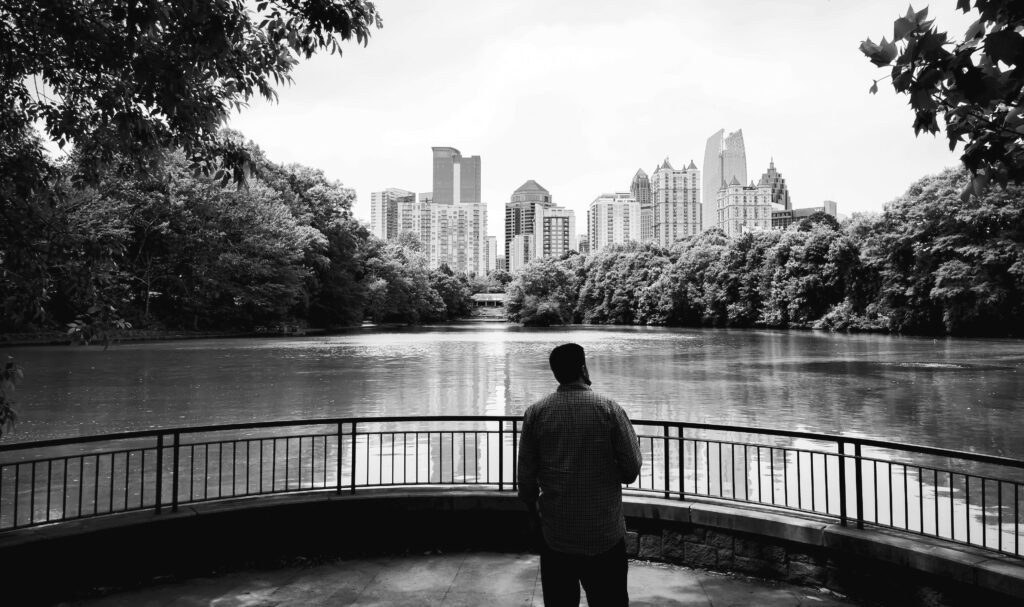 Person looking out over water toward downtown Atlanta