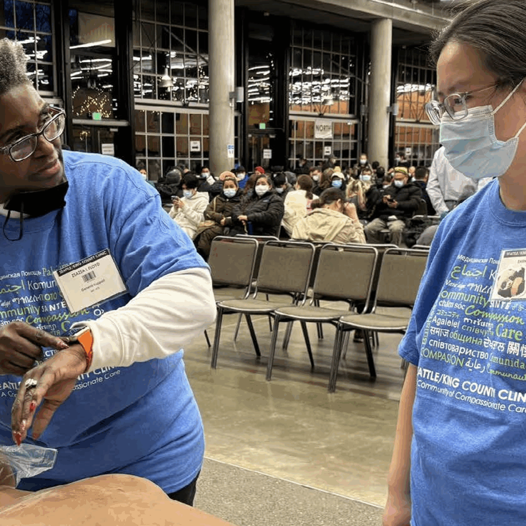 Health worker demonstrating how to care for someone who has overdosed