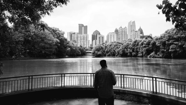 Person looking out over water toward downtown Atlanta