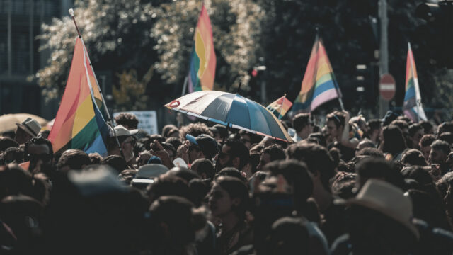 crowd at pride parade. photo by Mick de Paola on Unsplash