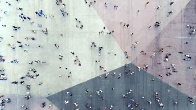 Overhead image of people standing in an outdoor square