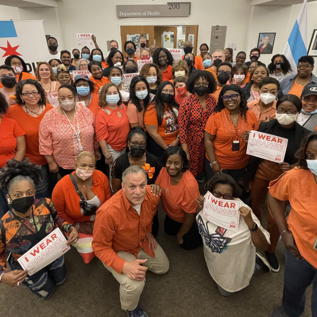 Chicago public health workers wearing orange for violence prevention