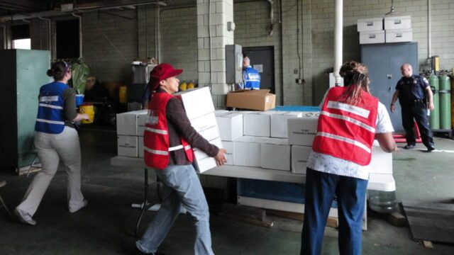 Baltimore public health workers distribute emergency medical supplies